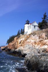 Bass Harbor Head Lighthouse from below and looking east at the shoreline. Photo
