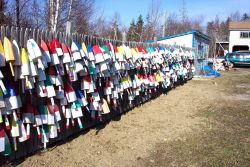 Floats for lobster traps adorning a Maine fence. Image