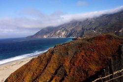 Looking north along the Big Sur coastline with fog-shrouded peaks. Image