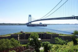 The 950-foot containership SEALAND COMMITMENT passing underneath the Verrazano Narrows Bridge. Photo