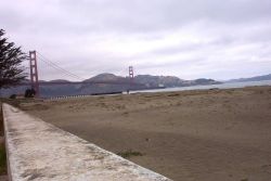 A ship passing under the Golden Gate Bridge. Image