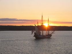 Delaware's tall ship, the KALMAR NYCKEL, sailing into the sunset Photo