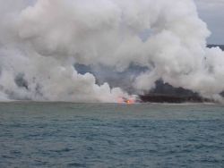 Lava flow entering the sea on SE coast of Hawaii. Image
