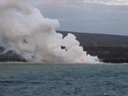 Lava flow entering the sea on SE coast of Hawaii. Image