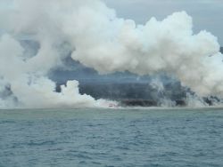 Lava flow entering the sea on SE coast of Hawaii. Image