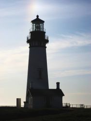 Yaquina Head Lighthouse with a sundog overhead Photo