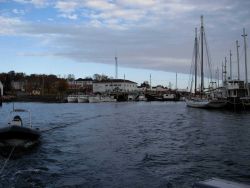 Leaving Eastport harbor and looking back at the Coast Guard pier and building. Image
