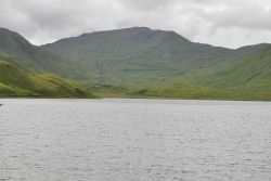 Looking up a bay to the switchback road into the mountains above Dutch Harbor. Image