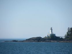 Cape Decision Lighthouse seen from offshore. Image