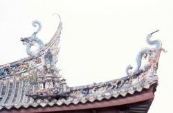 Ornate dragons adorn a temple roof. Photo