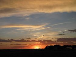 Sunset with contrails after a day of studying storms on VORTEX2 Photo