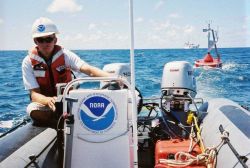 A CREWS buoy is towed from NOAA ship TOWNSEND CROMWELL for deployment in shallow water. Image