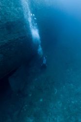 Diver below stern and upside-down rudder of the NORTHERN LIGHT, a shipwreck in 190 feet water depth Image