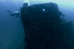 Divers on the shipwreck of the NORTHERN LIGHT at 190 feet. Image