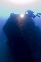 Diver on the bow of the NORTHERN LIGHT at nearly 190 feet water depth. Image