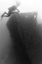 Divers on the bow of the NORTHERN LIGHT at nearly 190 feet water depth. Image