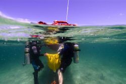 Recovery of a ship's bell at the PARKER shipwreck site. Image