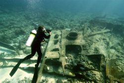 Maritime Heritage team member Brenda Altmeier recording data from the wreck of the Scottish ship DUNNOTAR CASTLE. Image