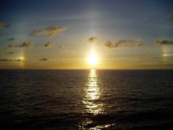 A tropical sunset over a placid sea. Photo