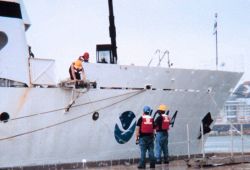 Preparing to secure the McARTHUR's gangway at Key West. Image