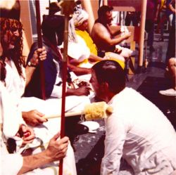 Lieutenant Archie Patrick, striving to become a shellback, during Equator crossing ceremonies on the ESSA Ship DISCOVERER. Image