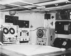 Various types of sounding recorders and other electronic equipment in the plotting room of the Coast and Geodetic Survey Ship EXPLORER. Image
