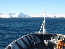 Removing ice after getting in the lee of land. Image