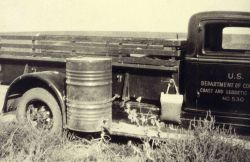 Bench mark truck showing mounting of water barrel Image