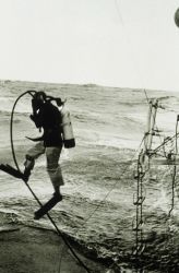 Lieutenant Larsen heading over the side to check if propeller fouled Image