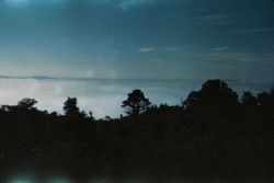 Looking down on the fog from a mountain prominence. Image