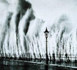 Waves striking seawall give appearance of geysers erupting Image