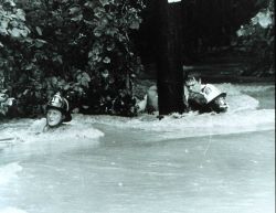 Dragging a rescued individual back to safety through the strong current The rescued man was lucky - many people have been killed by flash floods Image
