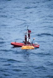A NOAA weather buoy off Alaska being serviced Image