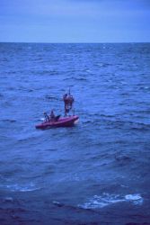 A NOAA weather buoy off Alaska being serviced Image