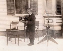 Wilson Bentley, the snowflake man, shown with his camera apparatus for photographing snowflakes Image