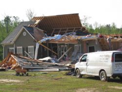 Damage to home in the Weldon Road area of Monroe County by an EF3 maximum strength tornado that struck Pike, Lamar, Monroe, and Butts Counties. Image