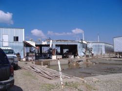 Damage to fish processing and preserving infrastructure. Image
