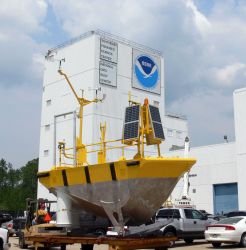 6-Meter Buoy being relocated through parking lot. Image