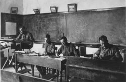 Signal Corps meteorological students working on records and computations in Record Room. Image