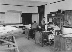 Signal Corps meteorological students working in the reference section. Image