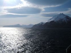 Wave clouds over the Islands of the Four Mountains. Image