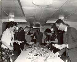 Visitors from Seward have lunch aboard the PATHFINDER. Image