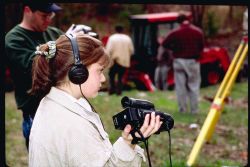 A local middle school student videotapes the soil testing procedures at the future dam removal site as part of a documentary the school is producing Image