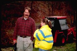 A technician is interviewed by a local middle school student working on a documentary about the dam removal Image