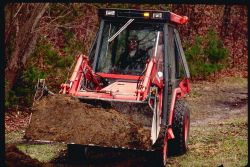 A bulldozer begins to unearth the dam for preliminary site testing purposes Image