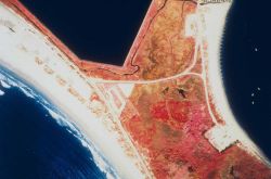 A color infrared aerial of Sachuest Marsh looking upstream and downstream prior to restoration. Image