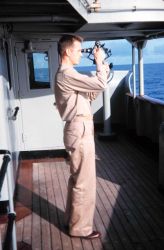 Lieutenant Harley Nygren taking a sun sight. Image