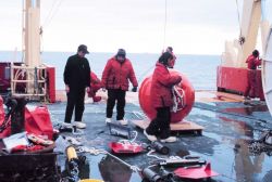 Deploying an upward looking RDI acoustic doppler current profiler on a mooring along the Ross Ice Shelf in the Ross Sea Photo