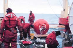 Deploying an upward looking RDI acoustic doppler current profiler on a mooring along the Ross Ice Shelf in the Ross Sea Image