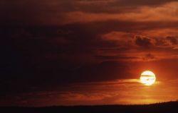 Smokey sunset along flat horizon Photo